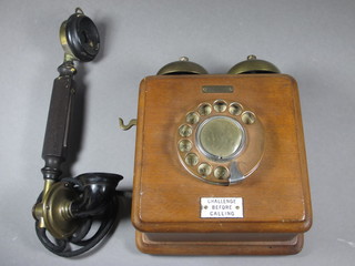 A wall mounted telephone