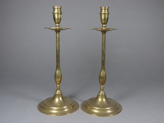 A pair of Art Nouveau brass candlesticks 12"