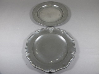 A pewter plate with bracketed border and armorial decoration, the reverse marked Thomas Chamberlain 9 1/2" and 1 other  pewter plate 9"