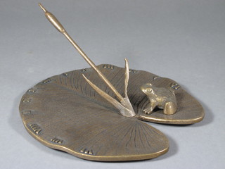 A bronze sun dial in the form of a lily pad with toad, the reverse marked WHF Swan 1986