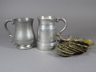2 pewter tankards and a collection of various horse brasses