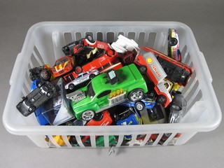 A crate of various toy cars