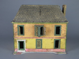 A wooden dolls house 16"