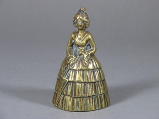 A brass table bell in the form of a crinoline lady 4"