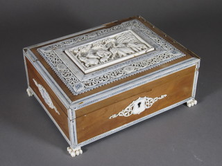 A handsome 19th Century sandalwood and ivory trinket box with  hinged lid, decorated pierced carved ivory panel of elephants 8"