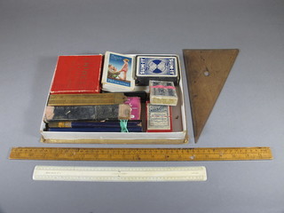A Fry's cardboard chocolate box containing various card games, rules and other curios