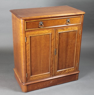A Victorian style walnut D shaped cabinet fitted 1 long drawer  above a double cupboard, by Charles Barr, 31"w x 17"d x 35"h