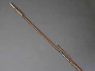 A twin section fishing rod, base marked Ogden Smith of London  with spare tip
