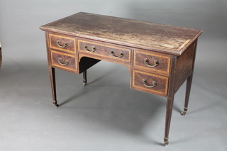 An Edwardian inlaid mahogany dressing table fitted 1 long and 4 short drawers, raised on square tapering supports ending in brass  caps and castors 45"w x 22"d x 30"h