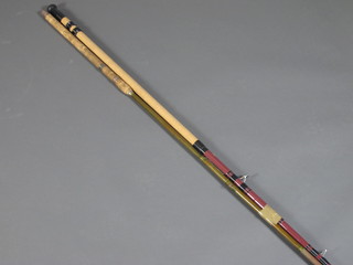 A Ryobi twin section carbon fibre fishing rod and a bamboo  fishing rod