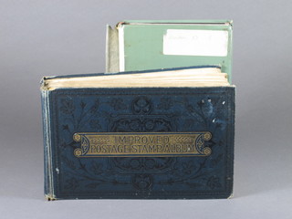 A green stock book of various stamps and an Improved Postage  Stamp album
