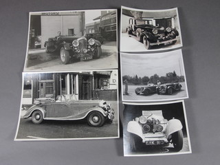 A collection of various black and white photographs of vintage cars