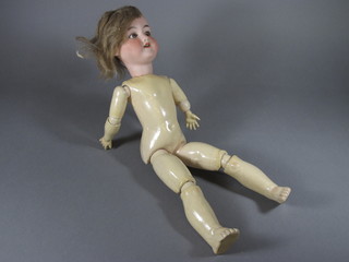 A German porcelain headed doll, the head incised 390 D R C M 246, with open and shutting eyes, open mouth and articulated  limbs 20"