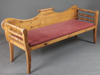 An elm settle with scroll decoration to the raised back 68"w x  24"d x 32"h