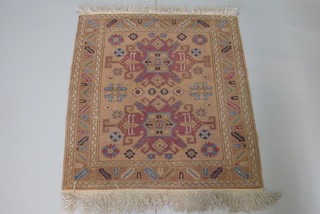 A brown ground Eastern rug with 2 stylised octagons to the  centre 38" x 33"