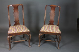 A pair of 18th/19th Century oak slat back dining chairs on cabriole supports with H framed stretchers