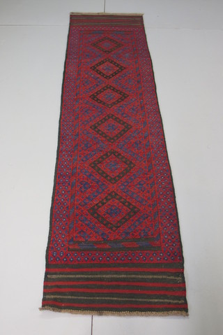 A Persian Sumar red ground runner with 6 octagons to the centre 100" x 24"