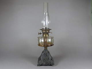 A Victorian glass oil lamp reservoir raised on a pierced iron base  13 1/2"