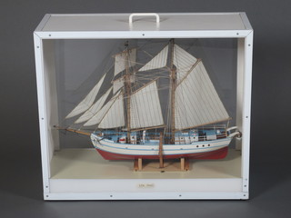A model of top sail schooner Lilla Dan 27", contained in a  glazed display cabinet