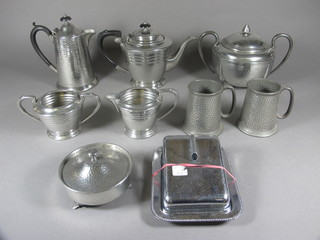 A Civic Pewter planished pewter teapot and matching hotwater  jug, a planished pewter twin handled jar and cover etc