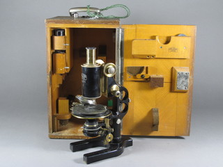 A Carl Zeiss single pillar microscope marked Karl Zeiss Jena NR100777 with 9 various lenses