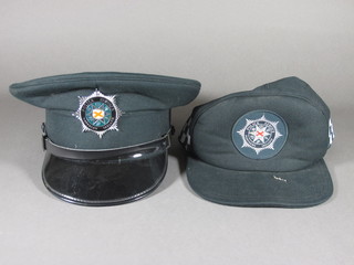 A Police Service of Northern Ireland cap and a do. baseball cap