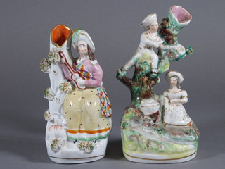 A Staffordshire vase decorated figures by a stream 6 1/2" and a Staffordshire vase decorated a figure of a standing lady - r, 6"