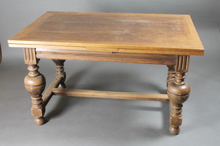 A 17th Century style honey oak refectory dining table raised on bulbous turned supports with H framed stretcher 51"w x 33"d x  29"h