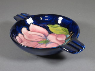 A Moorcroft blue glazed ashtray decorated pink magnolia, circa  1980's 6"