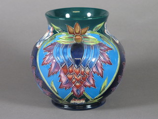 A Moorcroft 2001 circular blue and floral patterned vase, the base marked KL 6"  ILLUSTRATED