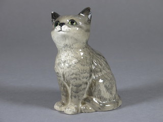 A Beswick figure of a seated kitten 3 1/2", chip to ear