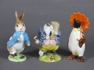 A Beswick figure of a standing penguin with parasol 4", f and r,  2 Beswick Beatrix Potter figures - Peter Rabbit and Tommy  Brook with gold back stamp mark