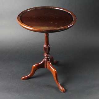 A turned mahogany wine table on pillar and tripod supports 14"