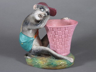 A 19th Century biscuit porcelain vase in the form of a seated  monkey studying a basket 5"