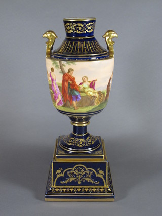 An "Austrian" twin handled urn decorated a classical scene with gilt mounts, raised on a square base, the base marked Adonis and  Ariadne Hero and Leander, 14 1/2"  ILLUSTRATED