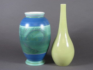 A Poole Studio Pottery vase decorated diving fish 10" and a  Poole green glazed club shaped vase 10"