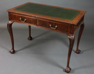 A Chippendale style mahogany writing table with inset tooled leather writing surface fitted 2 drawers, raised on cabriole ball  and claw supports 42"w x 24"d x 30"h   ILLUSTRATED