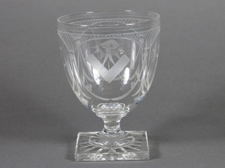 An 18th/19th Century etched Masonic glass with square and compasses, crescent moon, sun, all seeing eye, raised on a square  base 5"