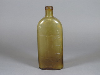 A Victorian amber glass Warners Safe Cure bottle 9"