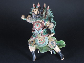 An Oriental pottery figure of a standing warrior 10"