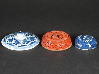 An Oriental blue and white lid 3", 1 other 2" - f, and a Redware  lid 2 1/2"