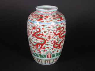 An Oriental famille vert vase decorated dragons, the base with 6 character mark 8"