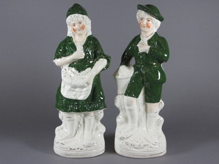 A pair of 19th Century Staffordshire figures of a fisherman and  fisher woman 13"