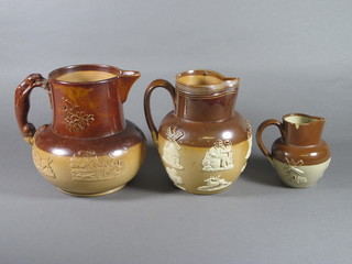 A Doulton Lambeth salt glazed hunting jug, the handle in the  form of a greyhound 7" and 2 Doulton stoneware jugs 6" and 4"