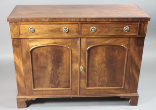 A 19th Century mahogany sideboard with crossbanded top fitted 2 long drawers above a double cupboard, raised on bracket feet  47"w x 17"d x 36"h