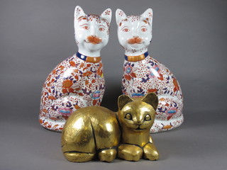 A gilt painted wooden figure of a seated cat 8" and 2 Imari style figures of seated cats 15"