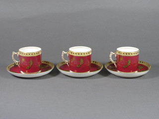An 18 piece 19th Century Continental red ground and floral  decorated coffee service 3 cups and 2 saucers cracked, the base  incised XX