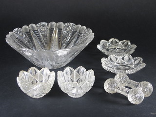 A circular cut glass bowl 9 1/2", a pair of circular cut glass bowls 3", 2 circular cut glass dishes 5" and a pair of cut glass  knife rests