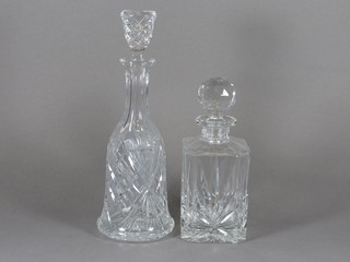 A cut glass bell shaped decanter and stopper 11" and a spirit  decanter and stopper 6"