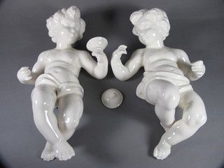 A pair of white glazed Spanish Hispania blanc de chine figures of cherubs 15", 1 f and r,